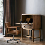 Featuring Bergstrom Warm Natural Oak Veneer Secretary Desk by Four Hands at Amethyst Home. A fresh take on the traditional secretary desk, made from warm natural oak. A flip-down top creates a wide writing surface, offering the perfect place to pen a handwritten note. Overall Dimensions: 35.00"w x 18.00"d x 48.00"h. Amethyst Home provides interior design, new home construction design consulting, vintage area rugs, and lighting in the Winter Garden metro area.