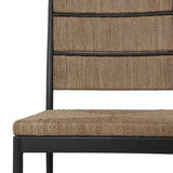 A steel dining chair frame is softened and paired with natural woven fibers. Thin, tapered legs and a tall channeled back cre