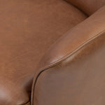 Smooth lines and impeccable tailoring bring a clean, elevated look to this modernized 360 swivel chair. Made from top-grain leather with a rich mahogany finish, flared arms and piping trim reflect the intention behind this timeless design Amethyst Home provides interior design, new home construction design consulting, vintage area rugs, and lighting in the Nashville metro area.