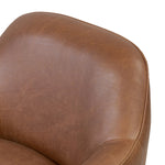 Smooth lines and impeccable tailoring bring a clean, elevated look to this modernized 360 swivel chair. Made from top-grain leather with a rich mahogany finish, flared arms and piping trim reflect the intention behind this timeless design Amethyst Home provides interior design, new home construction design consulting, vintage area rugs, and lighting in the Portland metro area.