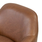 Smooth lines and impeccable tailoring bring a clean, elevated look to this modernized 360 swivel chair. Made from top-grain leather with a rich mahogany finish, flared arms and piping trim reflect the intention behind this timeless design Amethyst Home provides interior design, new home construction design consulting, vintage area rugs, and lighting in the Portland metro area.