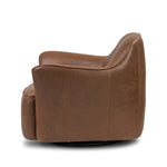 Smooth lines and impeccable tailoring bring a clean, elevated look to this modernized 360 swivel chair. Made from top-grain leather with a rich mahogany finish, flared arms and piping trim reflect the intention behind this timeless design Amethyst Home provides interior design, new home construction design consulting, vintage area rugs, and lighting in the Tampa metro area.