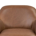 Smooth lines and impeccable tailoring bring a clean, elevated look to this modernized 360 swivel chair. Made from top-grain leather with a rich mahogany finish, flared arms and piping trim reflect the intention behind this timeless design Amethyst Home provides interior design, new home construction design consulting, vintage area rugs, and lighting in the Washington metro area.