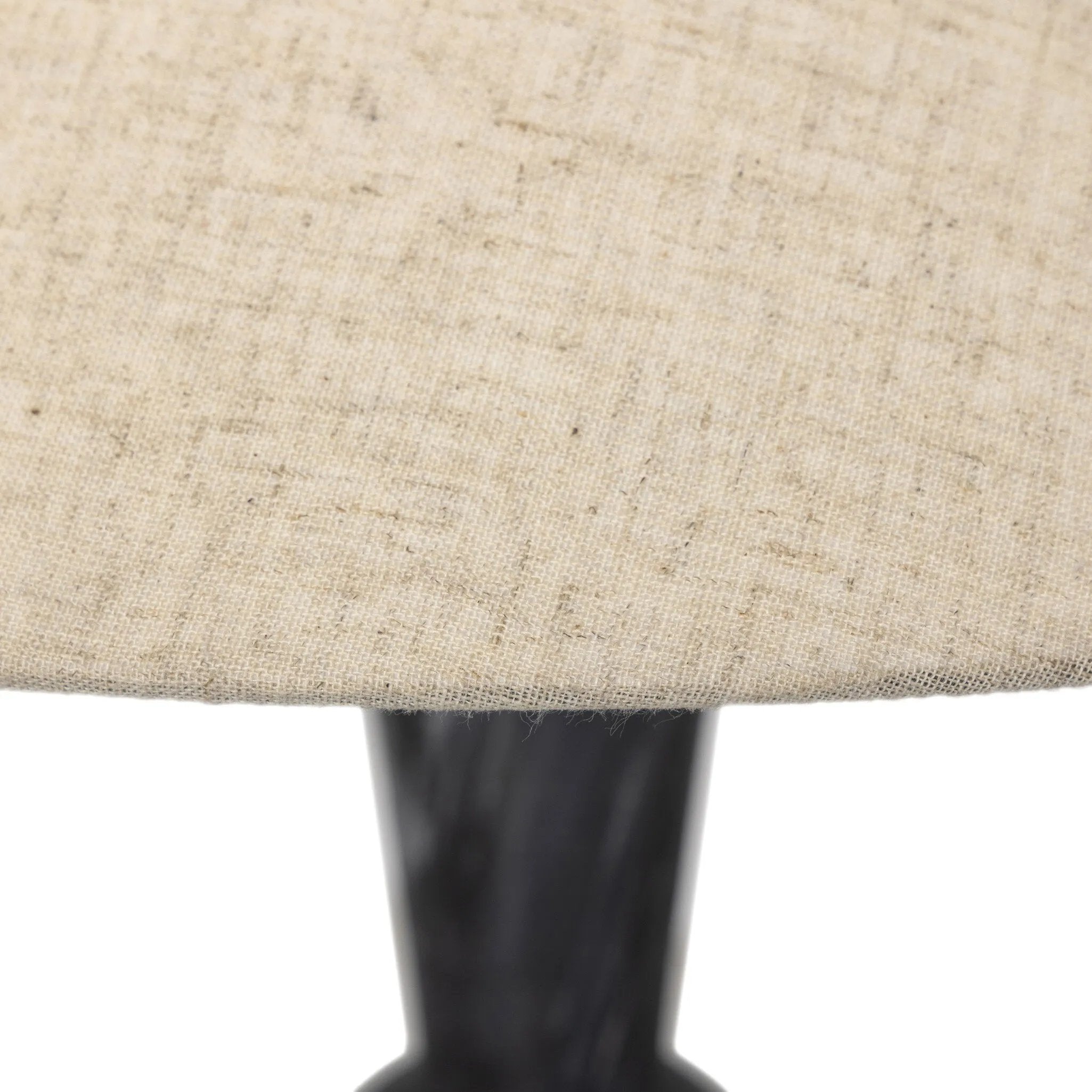 Polished forms define this sculptural table lamp, featuring a base of black Italian marble with distinctive white veining and a tapered flax linen shade Amethyst Home provides interior design, new home construction design consulting, vintage area rugs, and lighting in the Des Moines metro area.