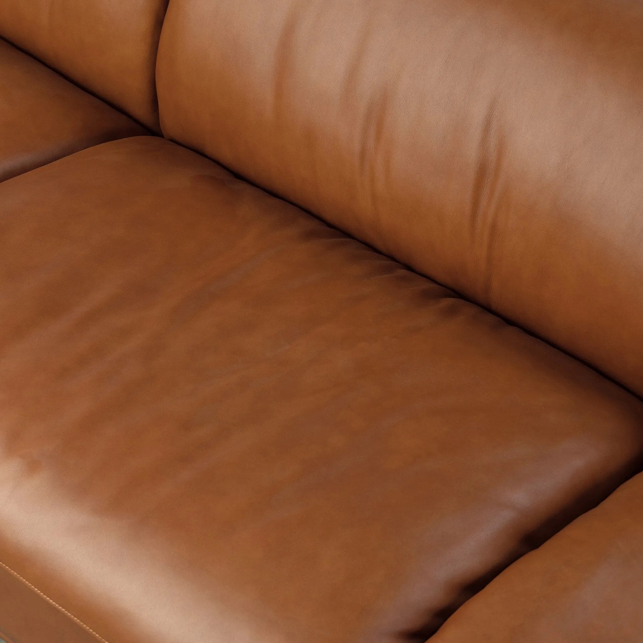 A low-slung and layered design inspired by mid-century Italian seating. The sofa balances a slim metal frame with a voluminous feather-blended interior wrapped in top-grain leather that only gets better with age.As enthusiasts of luxe style at Amethyst, we love the nature inspired Blaine Sofa -96" - Lorento Cognac. Amethyst Home provides interior design, new home construction design consulting, vintage area rugs, and lighting in the Park City metro area.