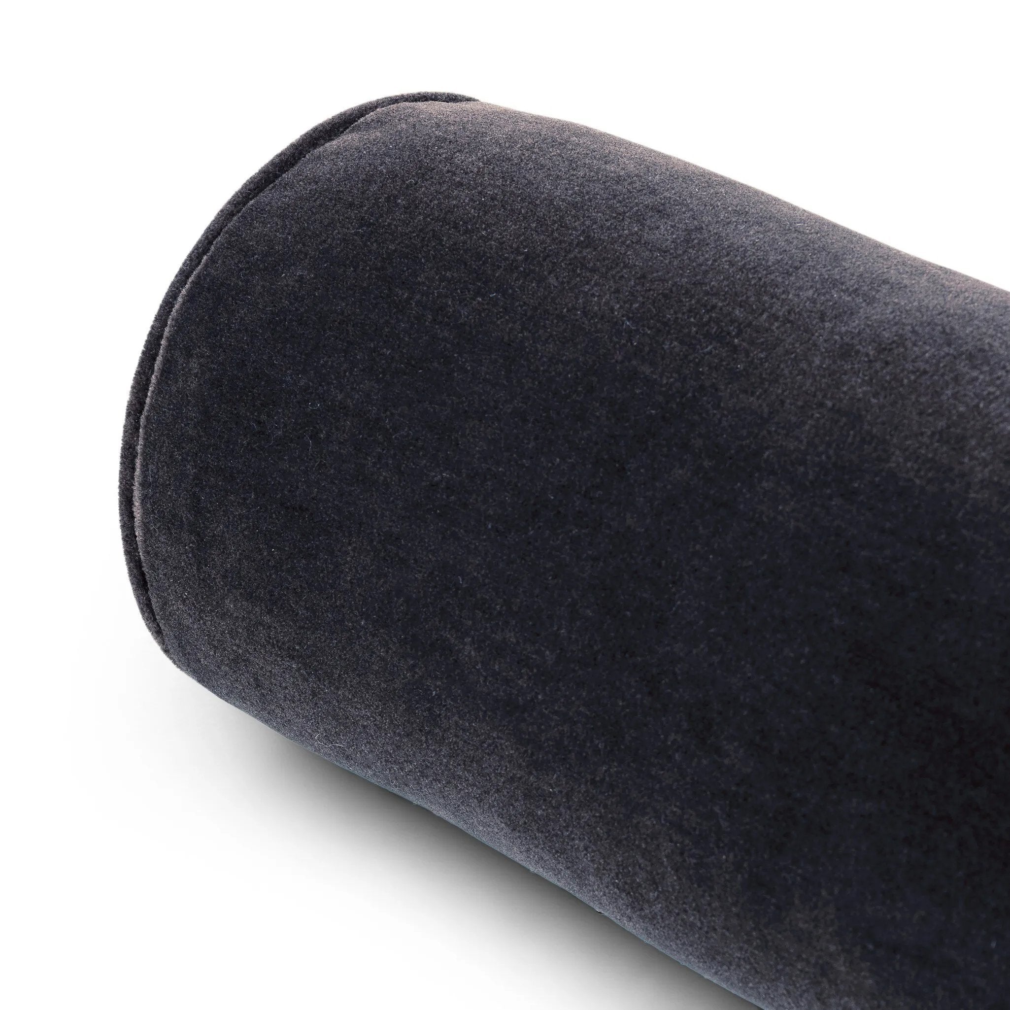 A long, navy-colored bolster pillow elevates beds and sofas in an instant. Crafted from saturated wool velvet, for a sustainable alternative to mohair, with a hidden zipper for a smooth silhouette.As lovers of wabi sabi aesthetics at Amethyst, we love the warm modern inspired Bridger Bolster Pillow - Monte Navy. Amethyst Home provides interior design, new home construction design consulting, vintage area rugs, and lighting in the Newport Beach metro area.