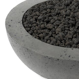 This outdoor fire table is a welcoming centerpiece designed for gathering. Made from glass-reinforced concrete, each piece is naturally finished with deep tones of pewter and dark grey. The bowl shape is completed with lavastones in the center, bringing together a bold, monochromatic look. Amethyst Home provides interior design, new home construction design consulting, vintage area rugs, and lighting in the Salt Lake City metro area.