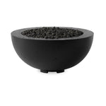 This outdoor fire table is a welcoming centerpiece designed for gathering. Made from glass-reinforced concrete, each piece is naturally finished with deep tones of charcoal. The bowl shape is completed with lavastones in the center, bringing together a bold, monochromatic look. Professional installation required to connect to a natural gas line. Amethyst Home provides interior design, new home construction design consulting, vintage area rugs, and lighting in the Park City metro area.