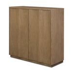 The classic wooden cabinet, reimagined. This warm oak piece features double doors with shallow scalloping that draws the eye, providing a subtle visual flow.As lovers of wabi sabi design at Amethyst, we love the designer inspired Brookhurst Small Cabinet - Drifted Oak Veneer. Amethyst Home provides interior design, new home construction design consulting, vintage area rugs, and lighting in the Portland metro area.