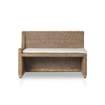 Antique-inspired coastal style. Rattan introduces varying natural shades and texture to this dining bench, and the frame's soft lines and fabric cushion invite a comfortable sit. Option to style alone or pair with other pieces in the collection. A design collaboration by Amber Lewis and Four Hands. Winner of the Domino Good Design Awards 2024. Amethyst Home provides interior design, new home construction design consulting, vintage area rugs, and lighting in the Kansas City metro area.