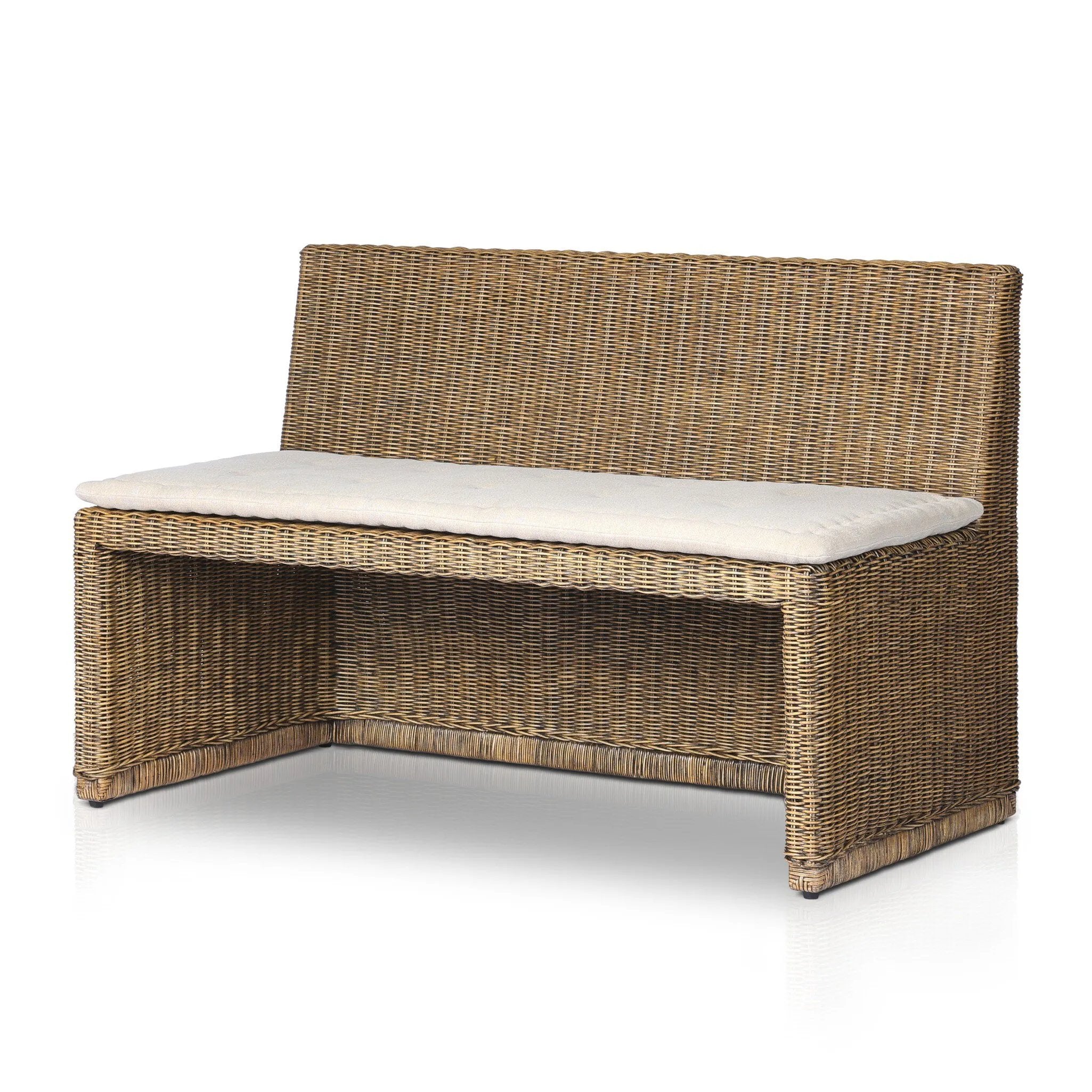Antique-inspired coastal style. Rattan introduces varying natural shades and texture to this dining bench, and the frame's soft lines and fabric cushion invite a comfortable sit. Option to style alone or pair with other pieces in the collection. A design collaboration by Amber Lewis and Four Hands. Winner of the Domino Good Design Awards 2024. Amethyst Home provides interior design, new home construction design consulting, vintage area rugs, and lighting in the Miami metro area.