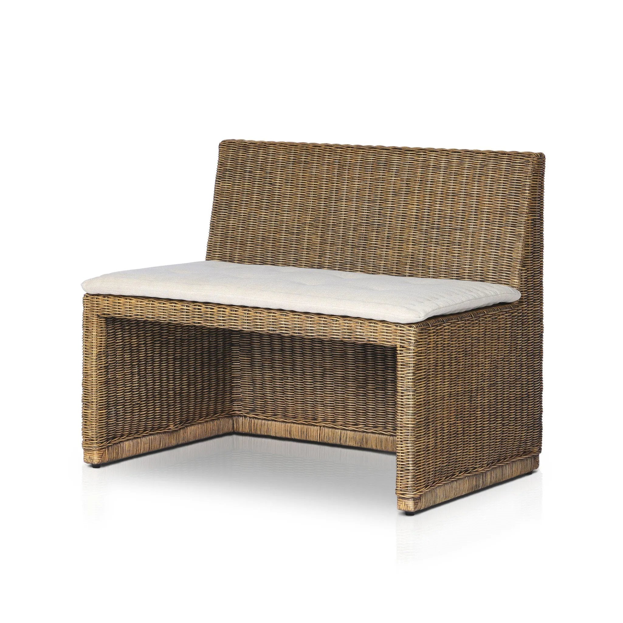 Antique-inspired coastal style. Rattan introduces varying natural shades and texture to this dining bench, and the frame's soft lines and fabric cushion invite a comfortable sit. Option to style alone or pair with other pieces in the collection. A design collaboration by Amber Lewis and Four Hands. Winner of the Domino Good Design Awards 2024. Amethyst Home provides interior design, new home construction design consulting, vintage area rugs, and lighting in the Washington metro area.