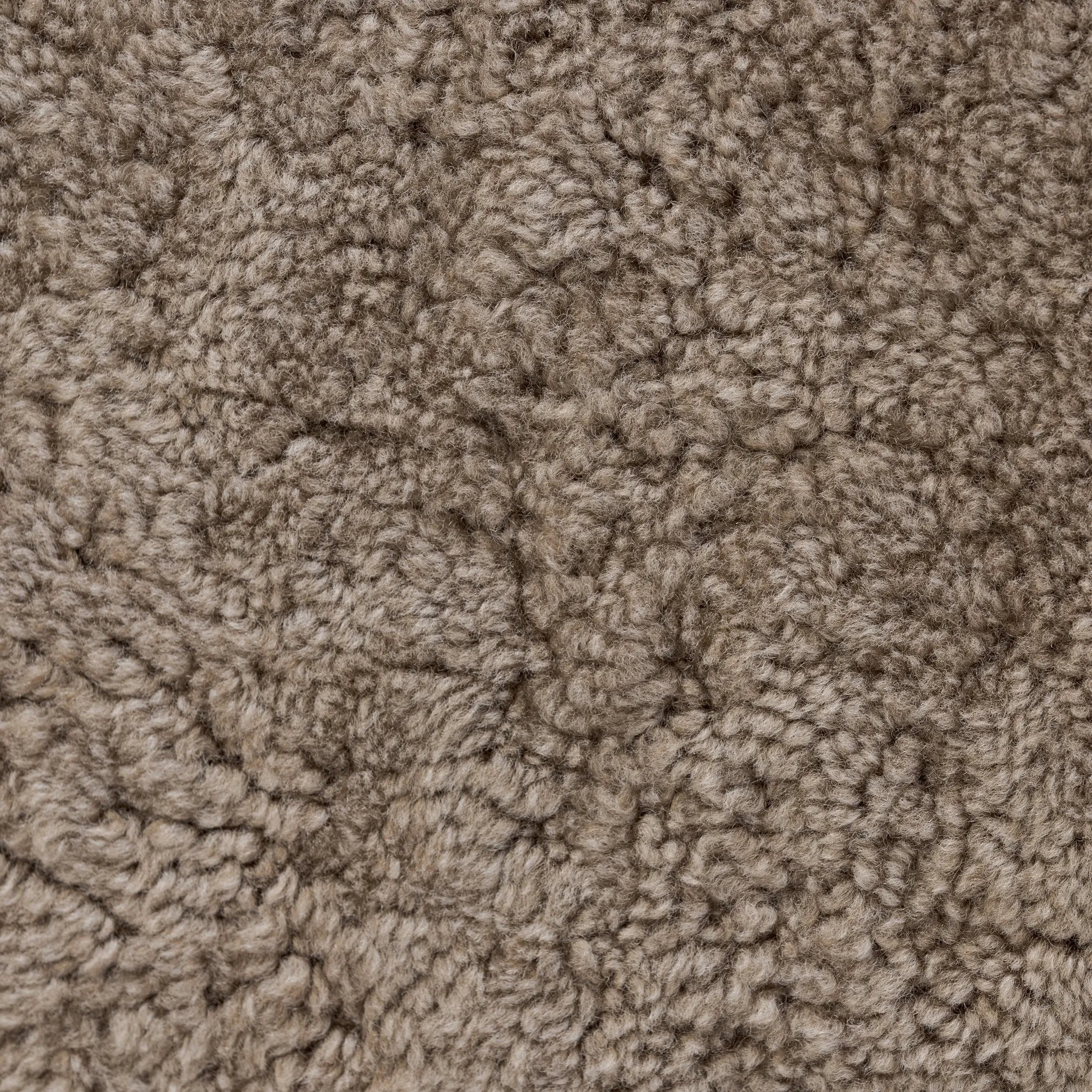 Soft texture and eye-catching contours fuse in this comfort-driven accent chair, pairing a low, luxurious shearling seat and dramatic bent wood frame Amethyst Home provides interior design, new home construction design consulting, vintage area rugs, and lighting in the Calabasas metro area.