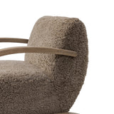 Soft texture and eye-catching contours fuse in this comfort-driven accent chair, pairing a low, luxurious shearling seat and dramatic bent wood frame Amethyst Home provides interior design, new home construction design consulting, vintage area rugs, and lighting in the Seattle metro area.