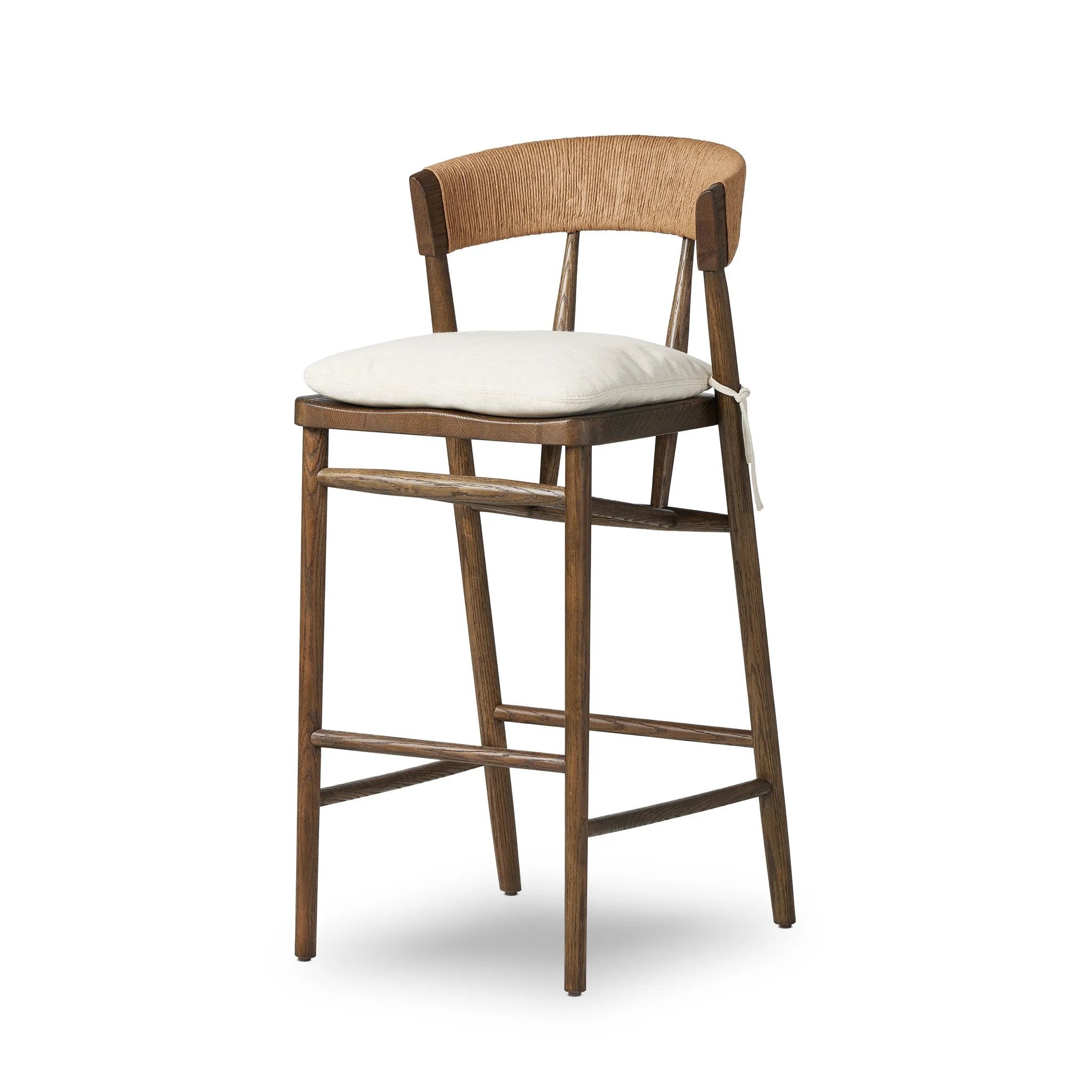 Featuring Buxton Savile Flax Bar + Counter Stool by Four Hands at Amethyst Home. A solid oak counter stool defined by tapered legs and framing gives an updated look to the classic whistler chair. Finished with a paper rush wrapped detail on the back.BarOverall Dimensions: 19.25"w x 22.25"d x 42.75"hWeight: 23.70 lbsCounterOverall Dimensions: 19.50"w x 22.25"d x. Amethyst Home provides interior design, new home construction design consulting, vintage area rugs, and lighting in the Miami metro area.