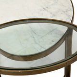 Featuring Calder Polished White Marble Nesting Coffee Table by Four Hands at Amethyst Home. Shapely surfaces, designed to slide together or apart with ease. A raw brass finish lends a lived-in feel to aluminum framing, with one oval-shaped nester topped by polished white marble pairing with a taller, rounded table featuring tempered glass.    Large Table: . Amethyst Home provides interior design, new home construction design consulting, vintage area rugs, and lighting in the Alpharetta metro area.