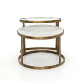 Featuring Calder Polished White Marble Nesting Coffee Table by Four Hands at Amethyst Home. Shapely surfaces, designed to slide together or apart with ease. A raw brass finish lends a lived-in feel to aluminum framing, with one oval-shaped nester topped by polished white marble pairing with a taller, rounded table featuring tempered glass.    Large Table: 3. Amethyst Home provides interior design, new home construction design consulting, vintage area rugs, and lighting in the Nashville metro area.