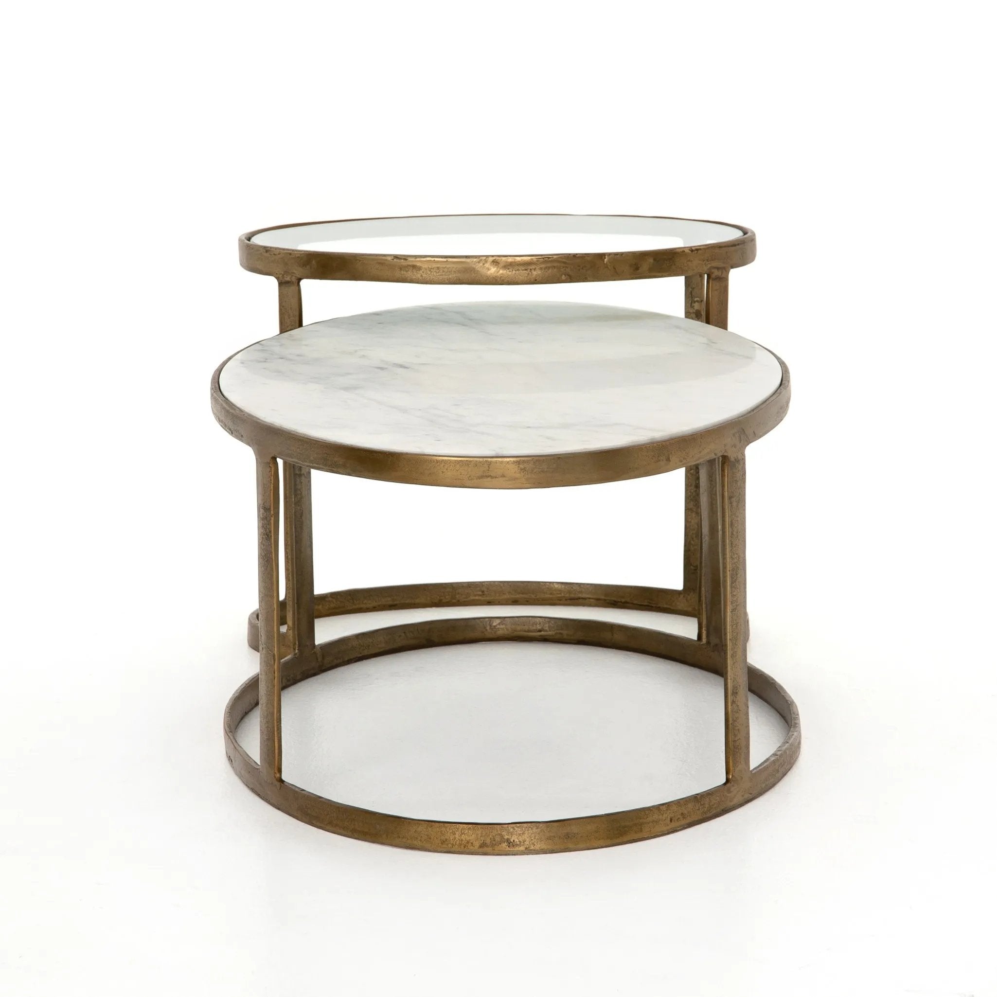 Featuring Calder Polished White Marble Nesting Coffee Table by Four Hands at Amethyst Home. Shapely surfaces, designed to slide together or apart with ease. A raw brass finish lends a lived-in feel to aluminum framing, with one oval-shaped nester topped by polished white marble pairing with a taller, rounded table featuring tempered glass.    Large Table: 3. Amethyst Home provides interior design, new home construction design consulting, vintage area rugs, and lighting in the Nashville metro area.