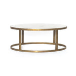 Featuring Calder Polished White Marble Nesting Coffee Table by Four Hands at Amethyst Home. Shapely surfaces, designed to slide together or apart with ease. A raw brass finish lends a lived-in feel to aluminum framing, with one oval-shaped nester topped by polished white marble pairing with a taller, rounded table featuring tempered glass.    Large Table: 3. Amethyst Home provides interior design, new home construction design consulting, vintage area rugs, and lighting in the Park City metro area.