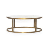Featuring Calder Polished White Marble Nesting Coffee Table by Four Hands at Amethyst Home. Shapely surfaces, designed to slide together or apart with ease. A raw brass finish lends a lived-in feel to aluminum framing, with one oval-shaped nester topped by polished white marble pairing with a taller, rounded table featuring tempered glass.    Large Table: 3. Amethyst Home provides interior design, new home construction design consulting, vintage area rugs, and lighting in the Park City metro area.