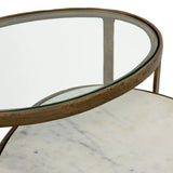 Featuring Calder Polished White Marble Nesting Coffee Table by Four Hands at Amethyst Home. Shapely surfaces, designed to slide together or apart with ease. A raw brass finish lends a lived-in feel to aluminum framing, with one oval-shaped nester topped by polished white marble pairing with a taller, rounded table featuring tempered glass.    Large Table: 38.. Amethyst Home provides interior design, new home construction design consulting, vintage area rugs, and lighting in the Seattle metro area.