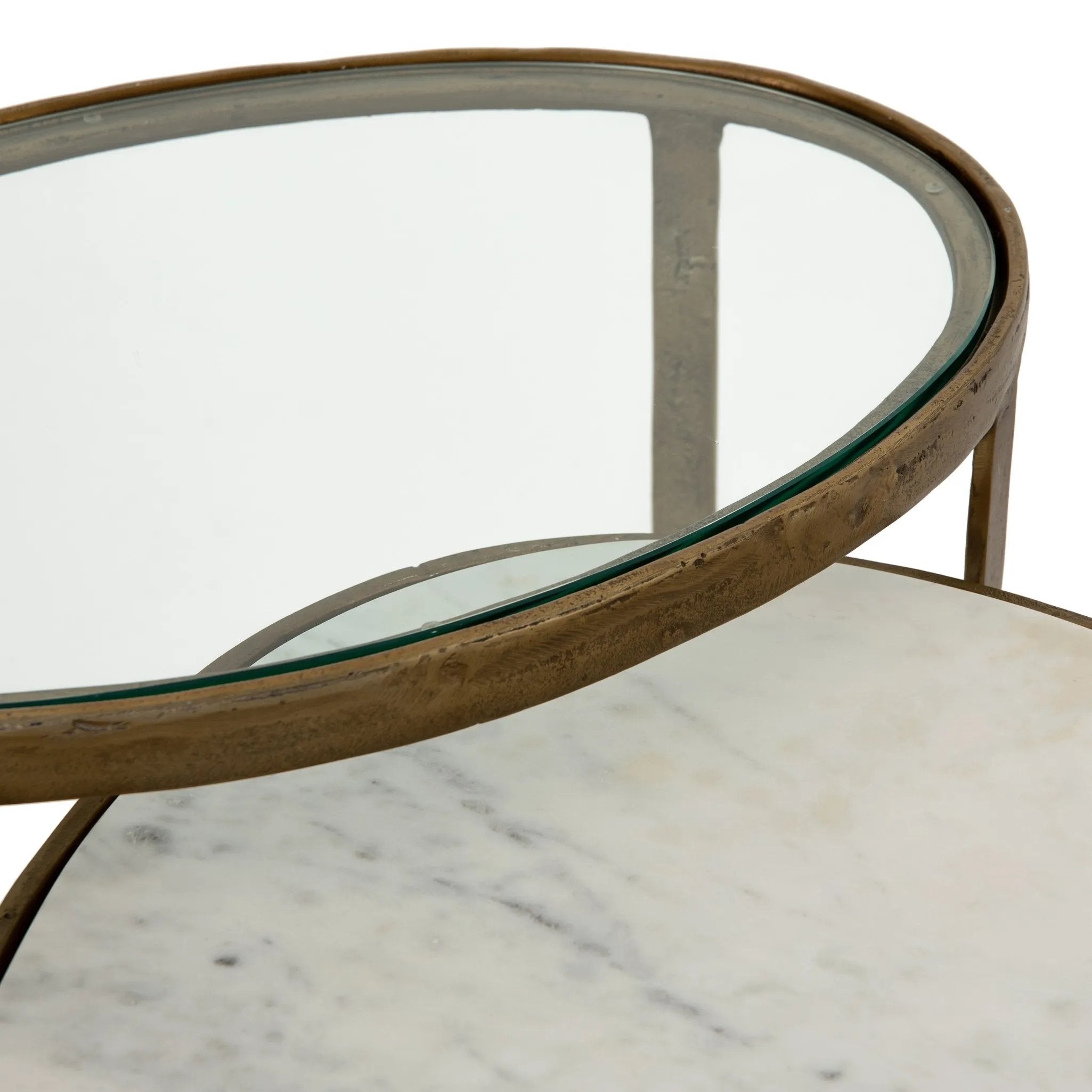 Featuring Calder Polished White Marble Nesting Coffee Table by Four Hands at Amethyst Home. Shapely surfaces, designed to slide together or apart with ease. A raw brass finish lends a lived-in feel to aluminum framing, with one oval-shaped nester topped by polished white marble pairing with a taller, rounded table featuring tempered glass.    Large Table: 38.. Amethyst Home provides interior design, new home construction design consulting, vintage area rugs, and lighting in the Seattle metro area.