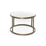 Featuring Calder Polished White Marble Nesting Coffee Table by Four Hands at Amethyst Home. Shapely surfaces, designed to slide together or apart with ease. A raw brass finish lends a lived-in feel to aluminum framing, with one oval-shaped nester topped by polished white marble pairing with a taller, rounded table featuring tempered glass.    Large Table: . Amethyst Home provides interior design, new home construction design consulting, vintage area rugs, and lighting in the Washington metro area.