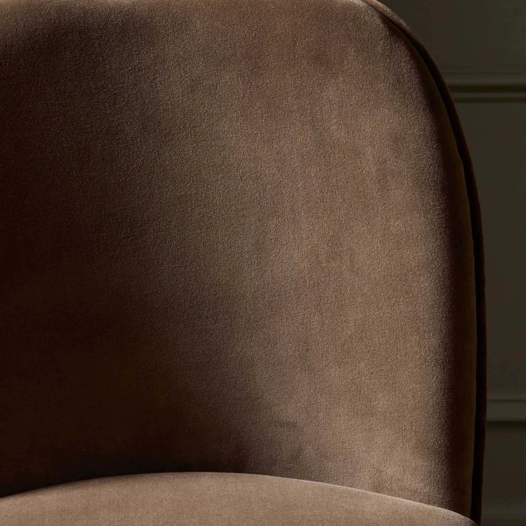 Solid ash wood forms a subtly curved back on this everyday counter stool. Its open frame and seat features rounded edges for 