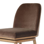 Solid ash wood forms a subtly curved back on this everyday counter stool. Its open frame and seat features rounded edges for 