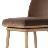 Solid ash wood forms a subtly curved back on this everyday counter stool. Its open frame and seat features rounded edges for 