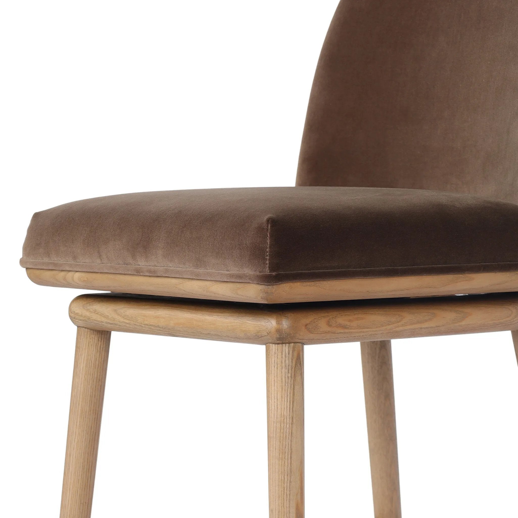 Solid ash wood forms a subtly curved back on this everyday counter stool. Its open frame and seat features rounded edges for 