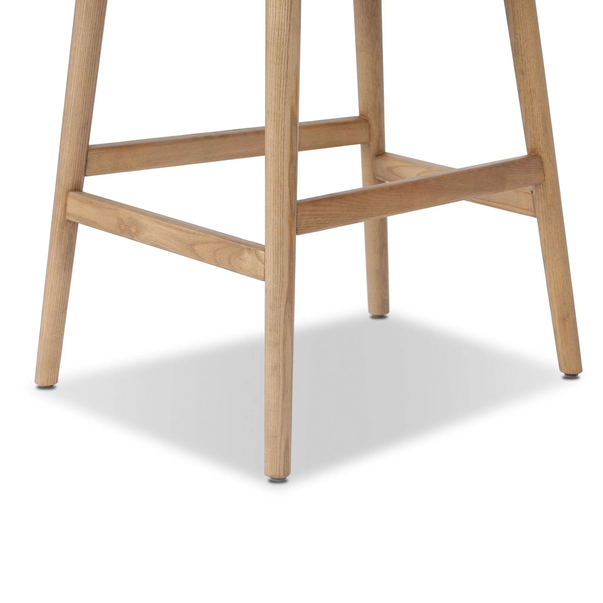 Solid ash wood forms a subtly curved back on this everyday counter stool. Its open frame and seat features rounded edges for 