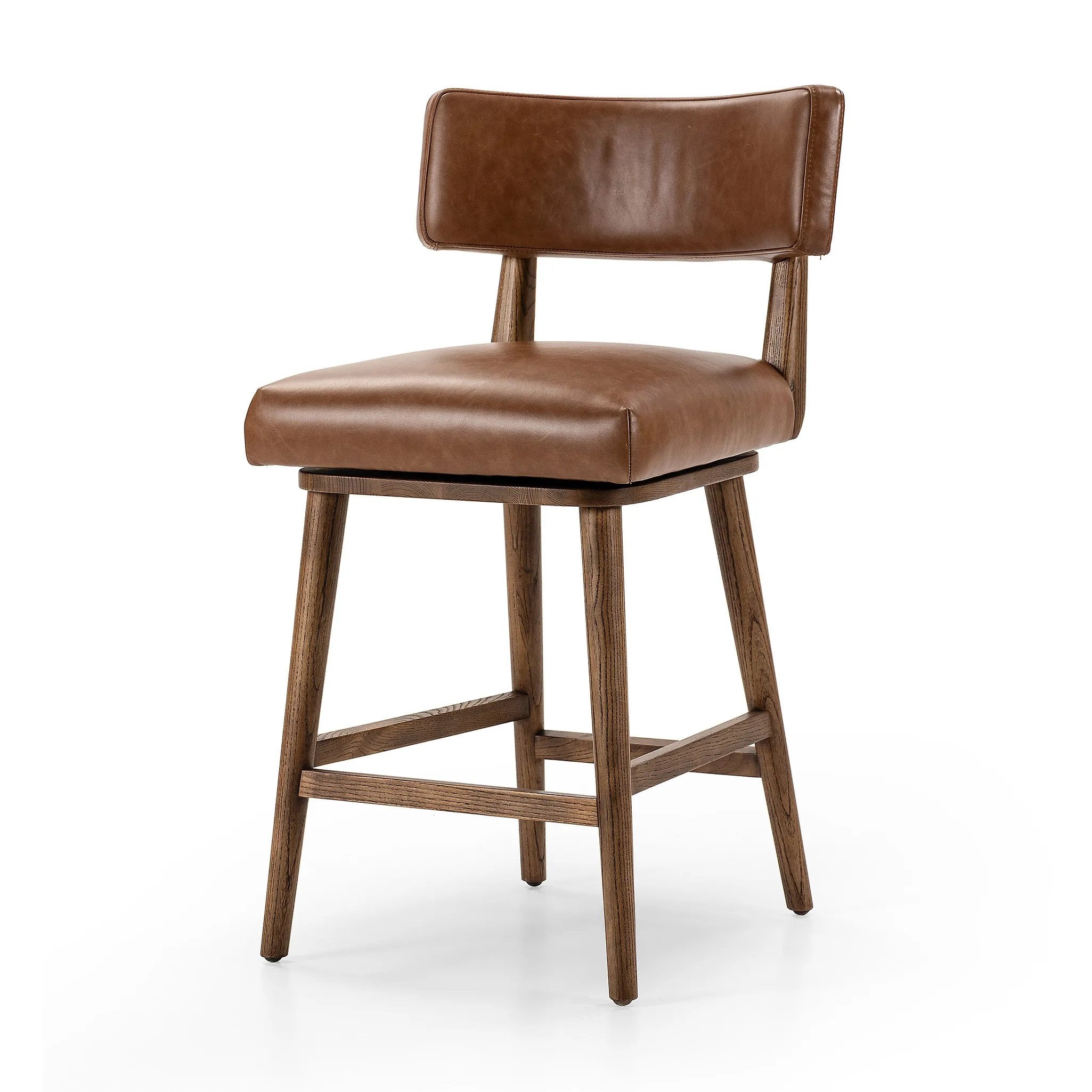 This reimagined classic pairs a barrel back frame of solid nettlewood with top-grain leather in a rich chestnut. A 180-degree swivel with return memory tops off the piece with fresh functionality Amethyst Home provides interior design, new home construction design consulting, vintage area rugs, and lighting in the Laguna Beach metro area.