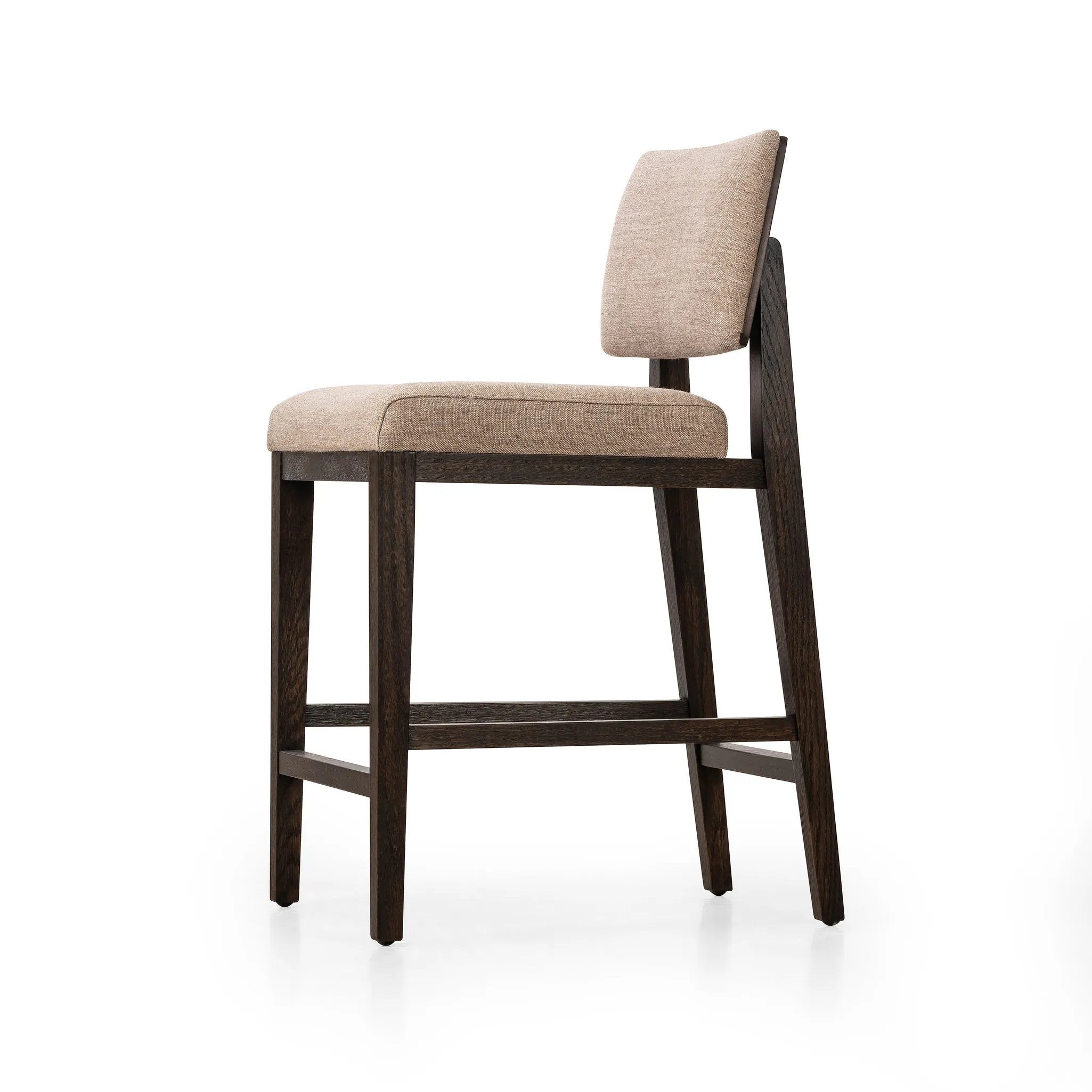 Featuring Carlo Alcala Fawn Bar + Counter Stool by Four Hands at Amethyst Home. Get back to the basics with this understated modern dining seating. Its simple shape includes a split back design that lets the upholstery peek through. High-performance fabric ideal for the counter, framed out by dark-finished oak.BarOverall Dimensions: 20.75"w x 26.00"d x 43.50"hW. Amethyst Home provides interior design, new home construction design consulting, vintage area rugs, and lighting in the Omaha metro area.