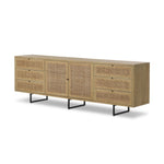 Featuring Carmel Natural Cane Sideboard 96" by Four Hands at Amethyst Home. Midcentury-inspired style with an organic twist. Surrounded by mango casing, light cane weaves for a fresh, natural look. Finished off with angular gunmetal-finished iron legs. Plenty of interior storage for your favorite table linens and dinnerware. Overall Dimensions: 96.00"w x 18.00. Amethyst Home provides interior design, new home construction design consulting, vintage area rugs, and lighting in the Austin metro area.