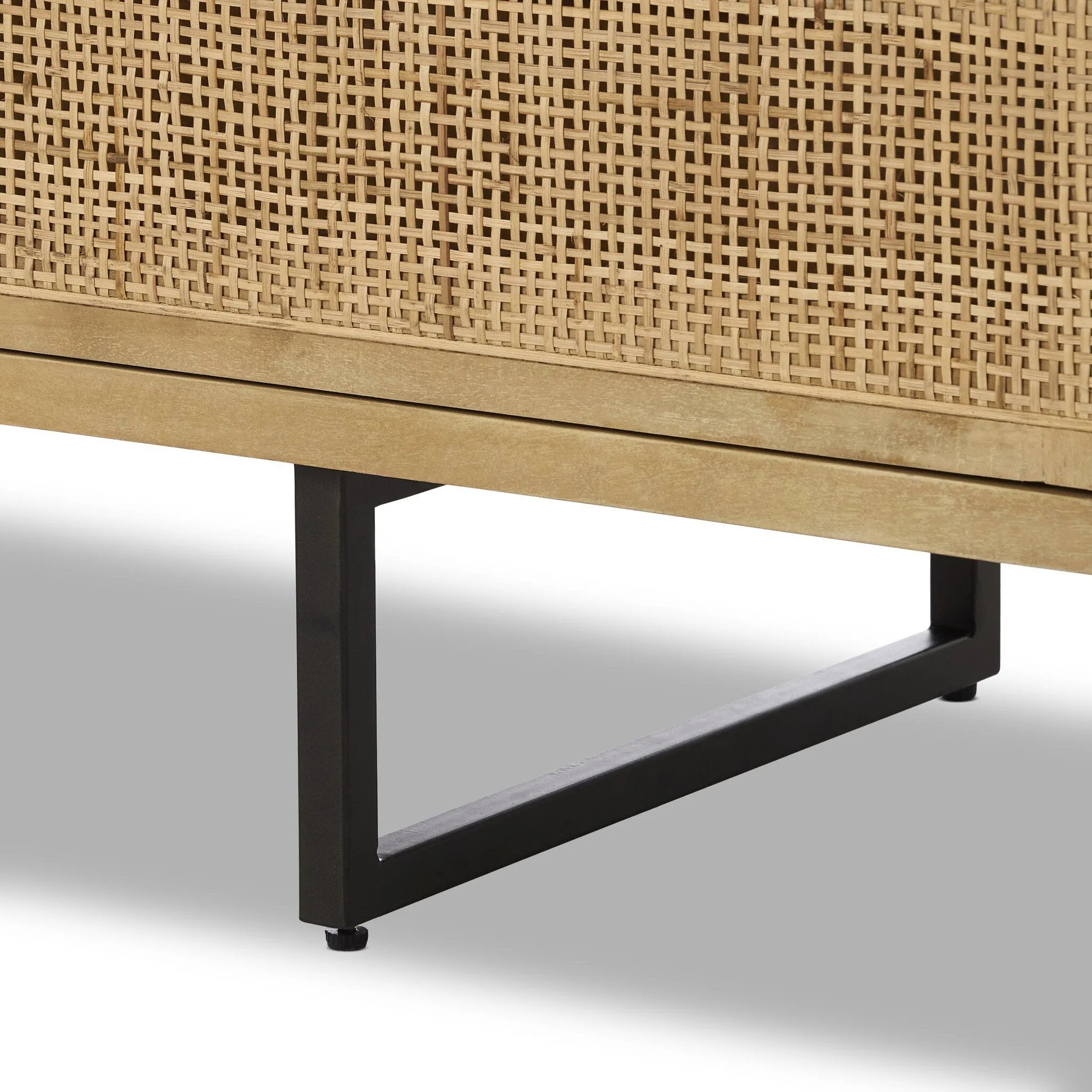 Featuring Carmel Natural Cane Sideboard 96" by Four Hands at Amethyst Home. Midcentury-inspired style with an organic twist. Surrounded by mango casing, light cane weaves for a fresh, natural look. Finished off with angular gunmetal-finished iron legs. Plenty of interior storage for your favorite table linens and dinnerware. Overall Dimensions: 96.00"w x 18. Amethyst Home provides interior design, new home construction design consulting, vintage area rugs, and lighting in the Calabasas metro area.