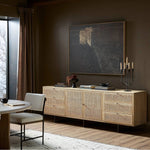 Featuring Carmel Natural Cane Sideboard 96" by Four Hands at Amethyst Home. Midcentury-inspired style with an organic twist. Surrounded by mango casing, light cane weaves for a fresh, natural look. Finished off with angular gunmetal-finished iron legs. Plenty of interior storage for your favorite table linens and dinnerware. Overall Dimensions: 96.00"w x 18. Amethyst Home provides interior design, new home construction design consulting, vintage area rugs, and lighting in the Charlotte metro area.
