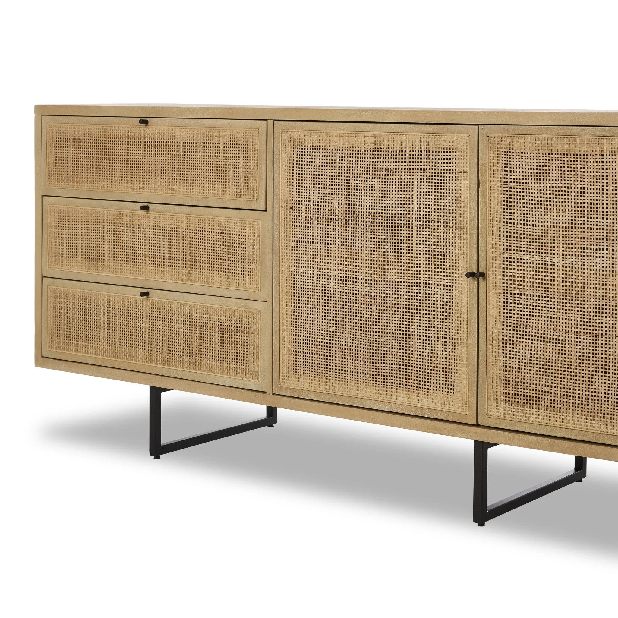 Featuring Carmel Natural Cane Sideboard 96" by Four Hands at Amethyst Home. Midcentury-inspired style with an organic twist. Surrounded by mango casing, light cane weaves for a fresh, natural look. Finished off with angular gunmetal-finished iron legs. Plenty of interior storage for your favorite table linens and dinnerware. Overall Dimensions: 96.00"w x 18.00". Amethyst Home provides interior design, new home construction design consulting, vintage area rugs, and lighting in the Omaha metro area.