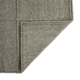 Hand woven in a flat weave grid pattern for the look of an indoor textile, this  silver-hued rug grounds the outdoor lounge with a high-texture look. Slight variation in sizing and imperfect lines due to the handcrafted nature of each piece are to be expected. Store inside during inclement weather and when not in use. Amethyst Home provides interior design, new home construction design consulting, vintage area rugs, and lighting in the Los Angeles metro area.
