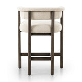 Featuring Cassie Charter Oatmeal Bar + Counter Stool by Four Hands at Amethyst Home. Upholstered in high-performance fabric, this sculpted bar stool features a comfortable yoke back and exterior fold detailing, all framed by solid ash. Performance fabrics are specially created to withstand spills, stains, high traffic and wear, ensuring long-term comfort and u. Amethyst Home provides interior design, new home construction design consulting, vintage area rugs, and lighting in the Austin metro area.