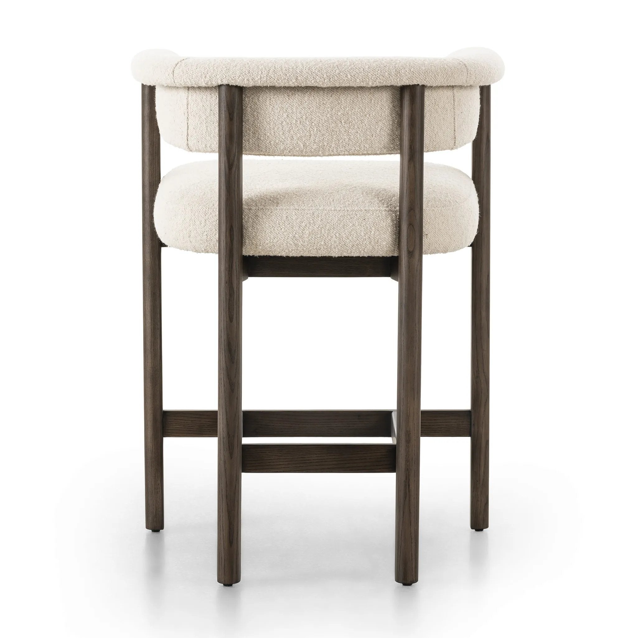 Featuring Cassie Charter Oatmeal Bar + Counter Stool by Four Hands at Amethyst Home. Upholstered in high-performance fabric, this sculpted bar stool features a comfortable yoke back and exterior fold detailing, all framed by solid ash. Performance fabrics are specially created to withstand spills, stains, high traffic and wear, ensuring long-term comfort and u. Amethyst Home provides interior design, new home construction design consulting, vintage area rugs, and lighting in the Austin metro area.