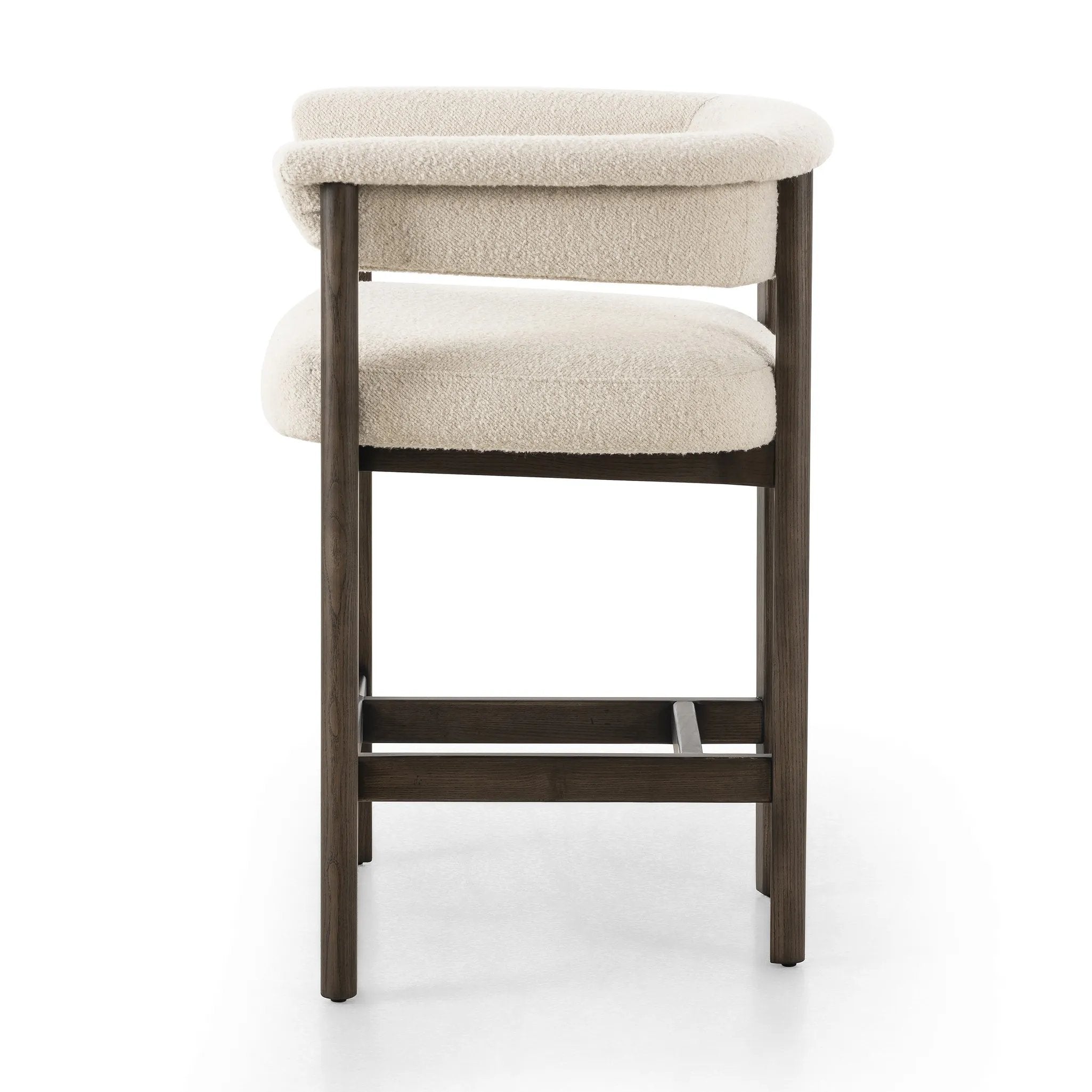 Featuring Cassie Charter Oatmeal Bar + Counter Stool by Four Hands at Amethyst Home. Upholstered in high-performance fabric, this sculpted bar stool features a comfortable yoke back and exterior fold detailing, all framed by solid ash. Performance fabrics are specially created to withstand spills, stains, high traffic and wear, ensuring long-term comfort and un. Amethyst Home provides interior design, new home construction design consulting, vintage area rugs, and lighting in the Omaha metro area.