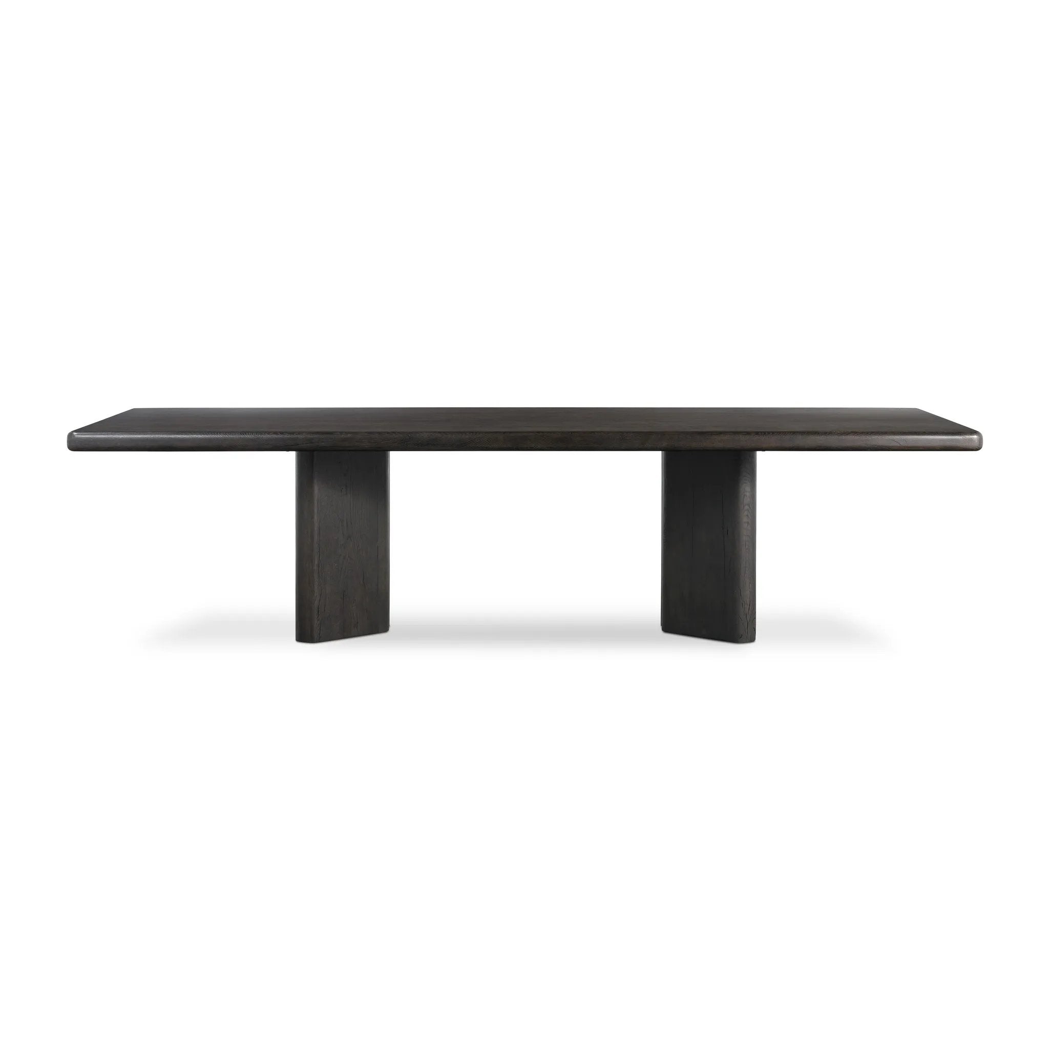 Designed in partnership with longtime Four Hands collaborator Thomas Bina and Brazilian designer Ronald Sasson, a grand-scale dining table is made from solid reclaimed French oak finished in a deep espresso. Rounded edges add a softer, fluid look. Seats 12 Amethyst Home provides interior design, new home construction design consulting, vintage area rugs, and lighting in the Los Angeles metro area.