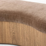 Elevate any room with a curvy statement bench. Made from a kidney-shaped base of toasted ash veneer and a soft, velvety seat Amethyst Home provides interior design, new home construction design consulting, vintage area rugs, and lighting in the Austin metro area.