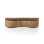 Elevate any room with a curvy statement bench. Made from a kidney-shaped base of toasted ash veneer and a soft, velvety seat Amethyst Home provides interior design, new home construction design consulting, vintage area rugs, and lighting in the Boston metro area.