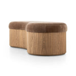 Elevate any room with a curvy statement bench. Made from a kidney-shaped base of toasted ash veneer and a soft, velvety seat Amethyst Home provides interior design, new home construction design consulting, vintage area rugs, and lighting in the Dallas metro area.