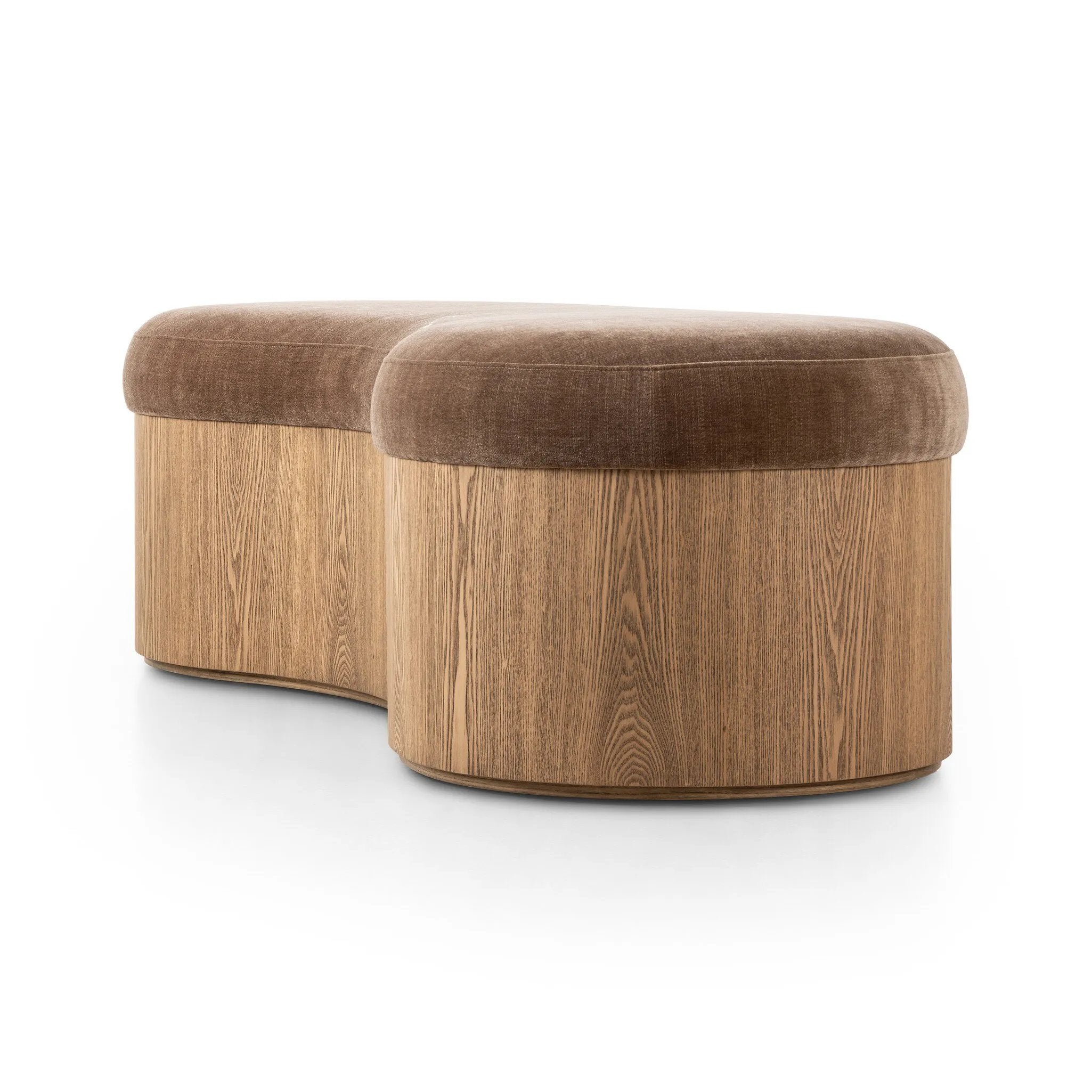 Elevate any room with a curvy statement bench. Made from a kidney-shaped base of toasted ash veneer and a soft, velvety seat Amethyst Home provides interior design, new home construction design consulting, vintage area rugs, and lighting in the Dallas metro area.
