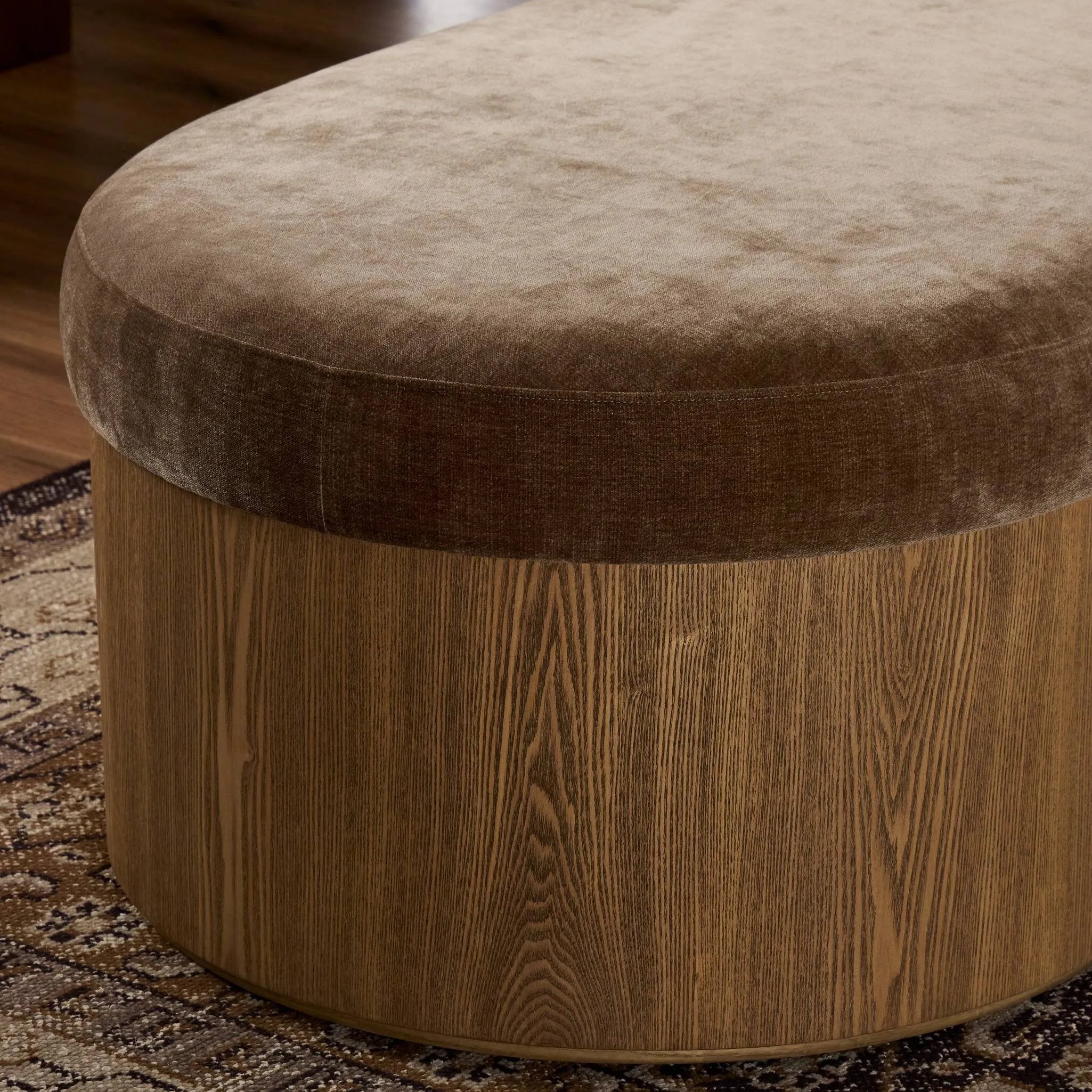 Elevate any room with a curvy statement bench. Made from a kidney-shaped base of toasted ash veneer and a soft, velvety seat Amethyst Home provides interior design, new home construction design consulting, vintage area rugs, and lighting in the Laguna Beach metro area.