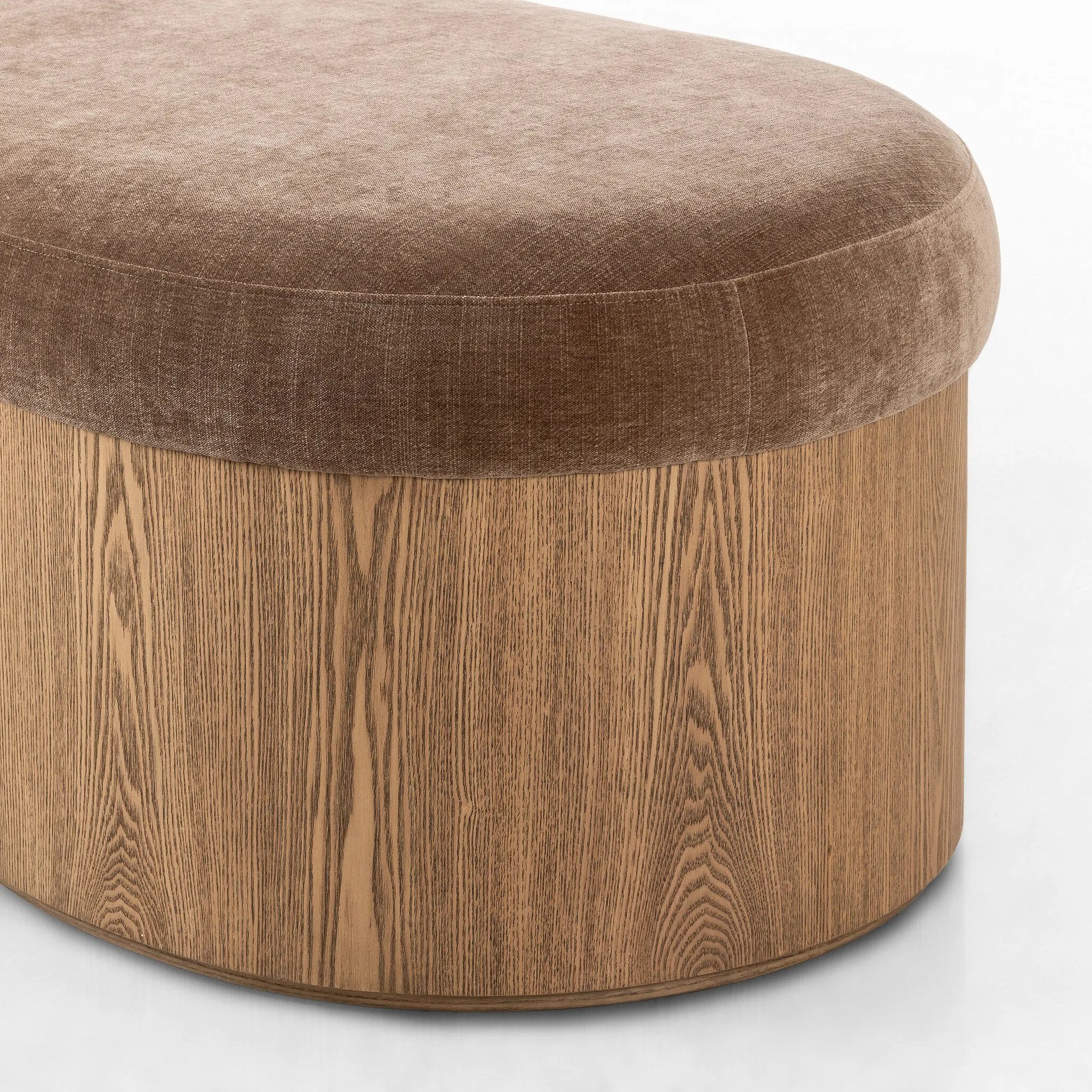 Elevate any room with a curvy statement bench. Made from a kidney-shaped base of toasted ash veneer and a soft, velvety seat Amethyst Home provides interior design, new home construction design consulting, vintage area rugs, and lighting in the Nashville metro area.