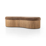 Elevate any room with a curvy statement bench. Made from a kidney-shaped base of toasted ash veneer and a soft, velvety seat Amethyst Home provides interior design, new home construction design consulting, vintage area rugs, and lighting in the Omaha metro area.